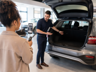 Dealership staff filming a vertical short-form vehicle walkaround video